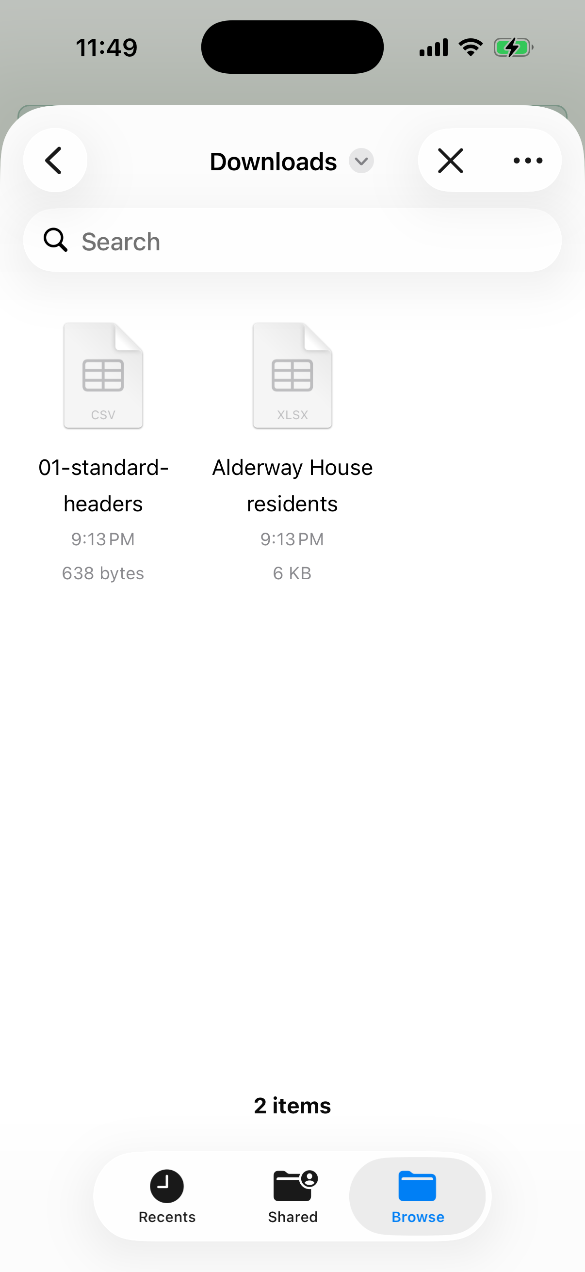 File picker open on Downloads showing a .csv file and an .xlsx workbook